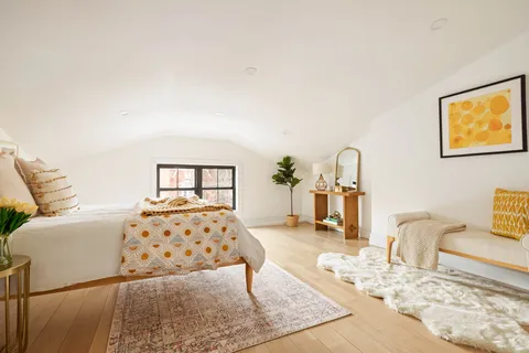 a living room with a bed