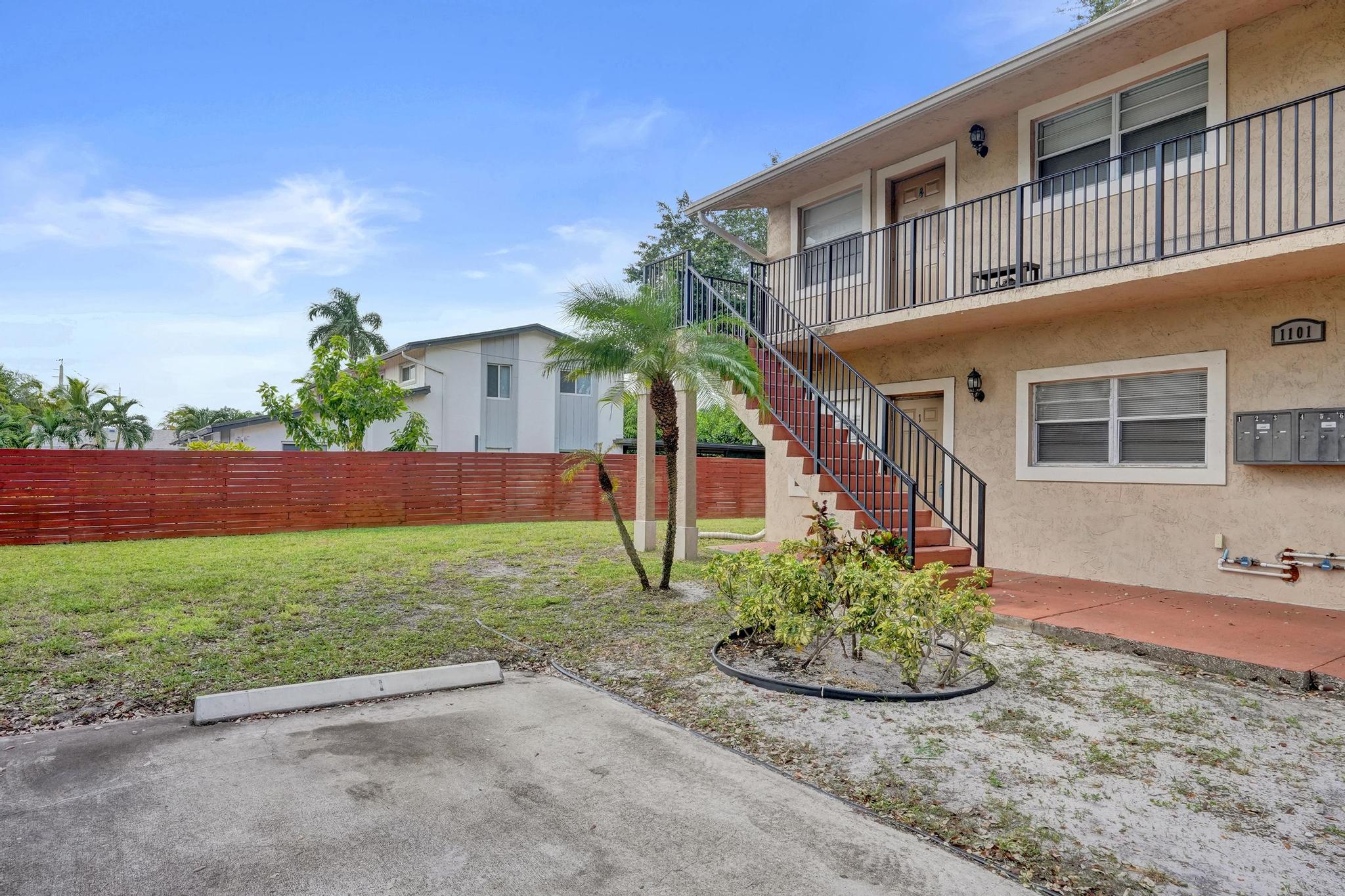 1101 Prospect Road Fort Lauderdale, FL 33309 - Photo 3 of 34 a front view of a house with garden