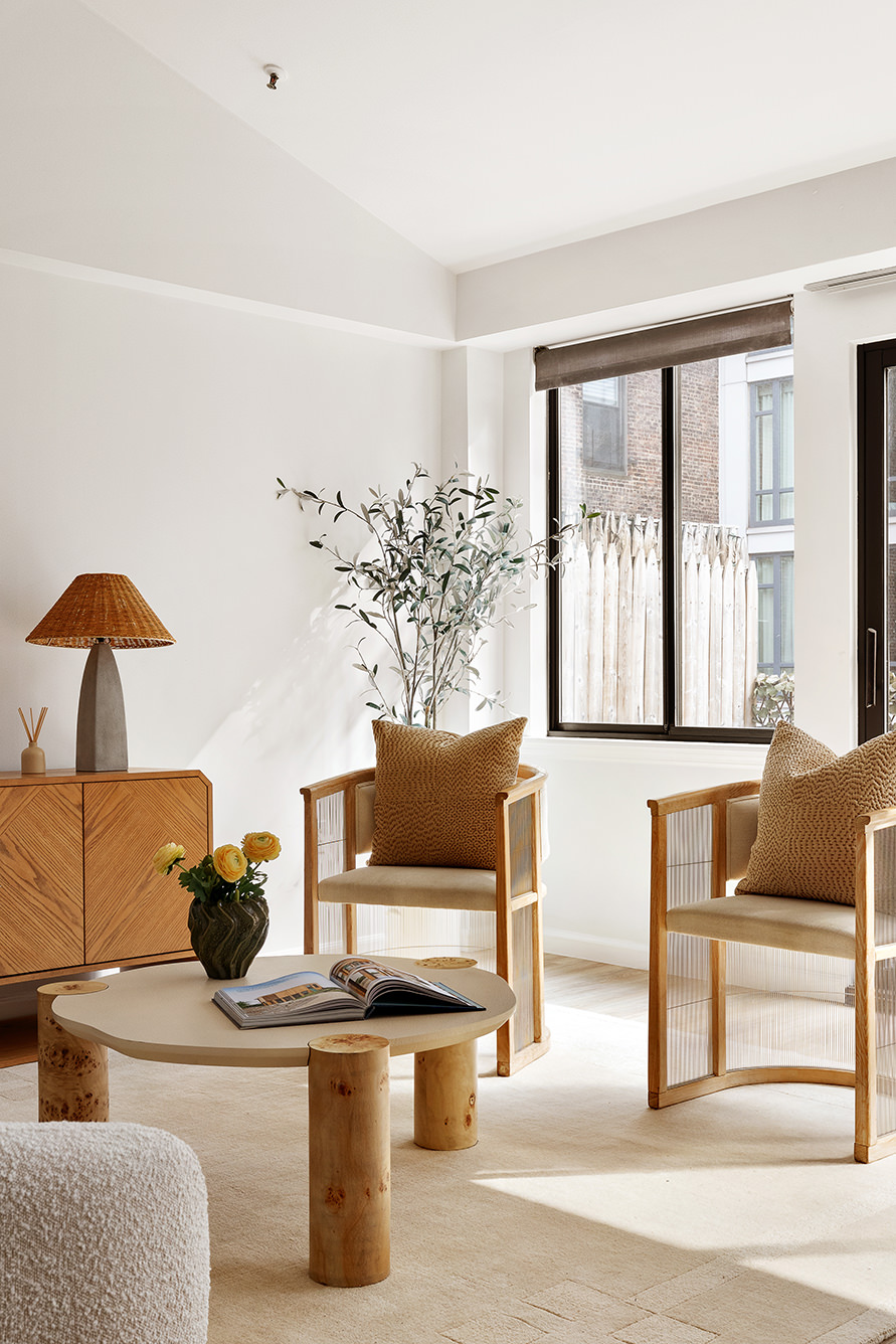 136-140 West 23rd Street, Unit PHD Manhattan, NY 10011 - Photo 7 of 15 a living room with furniture and a floor to ceiling window
