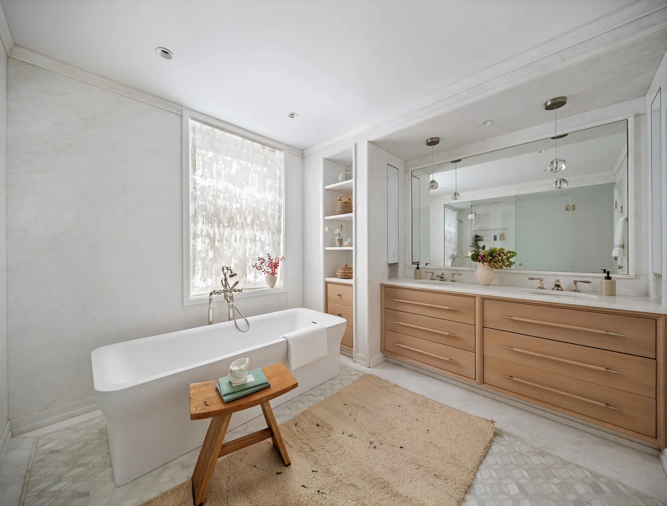 a spacious bathroom with a double vanity sink tub and mirror