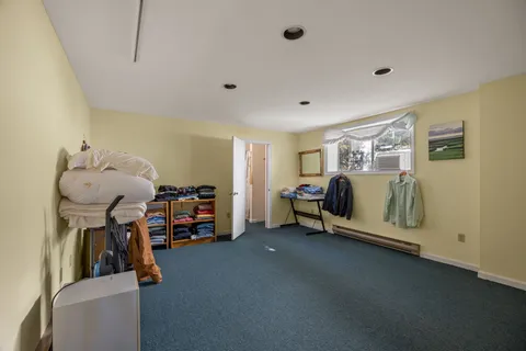 a bathroom with a sink mirror and toilet