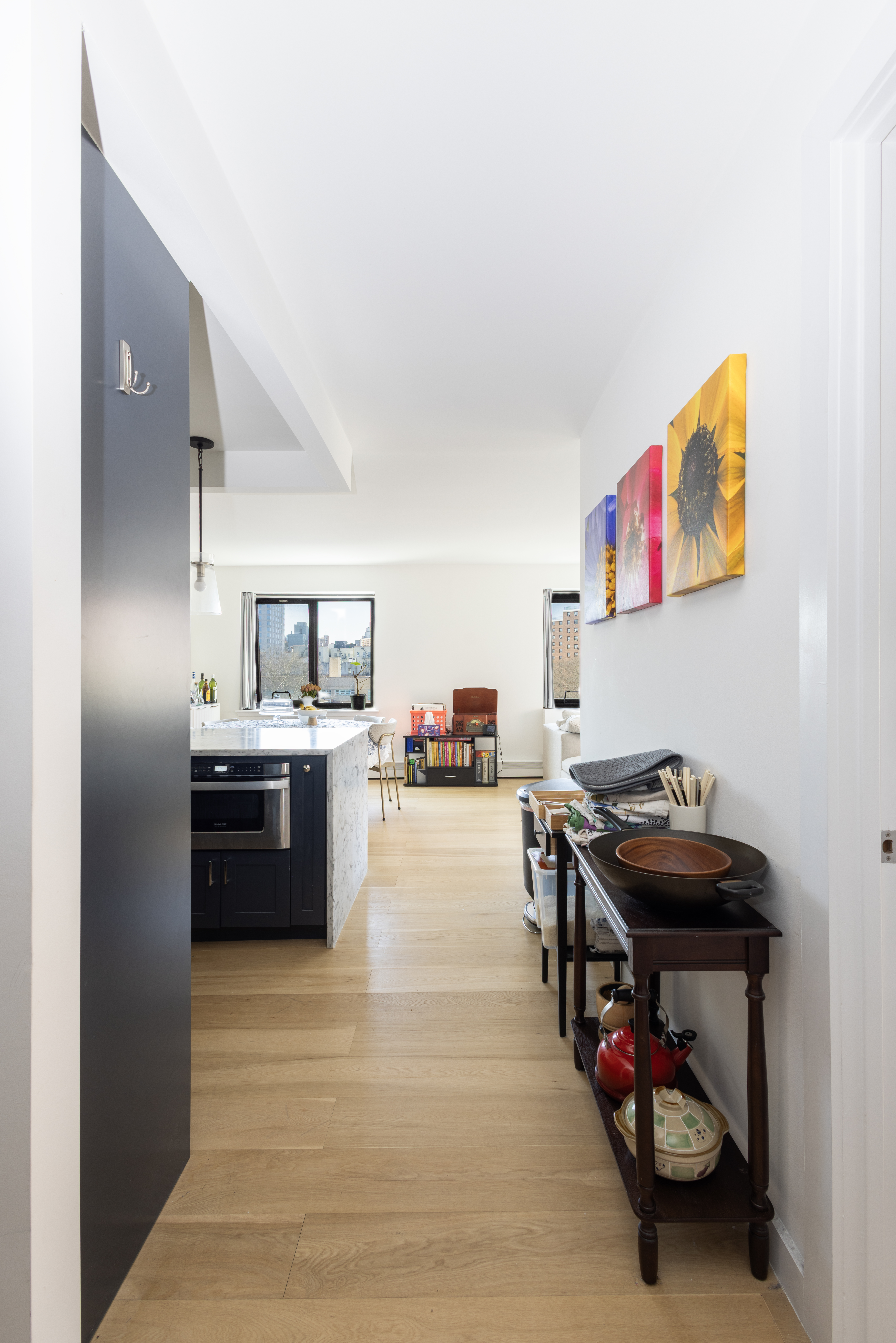 1330 5th Avenue, Unit 6C Manhattan, NY 10026 - Photo 6 of 16 a room with furniture and a flat screen tv