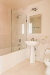 a bathroom with a sink a toilet and bathtub