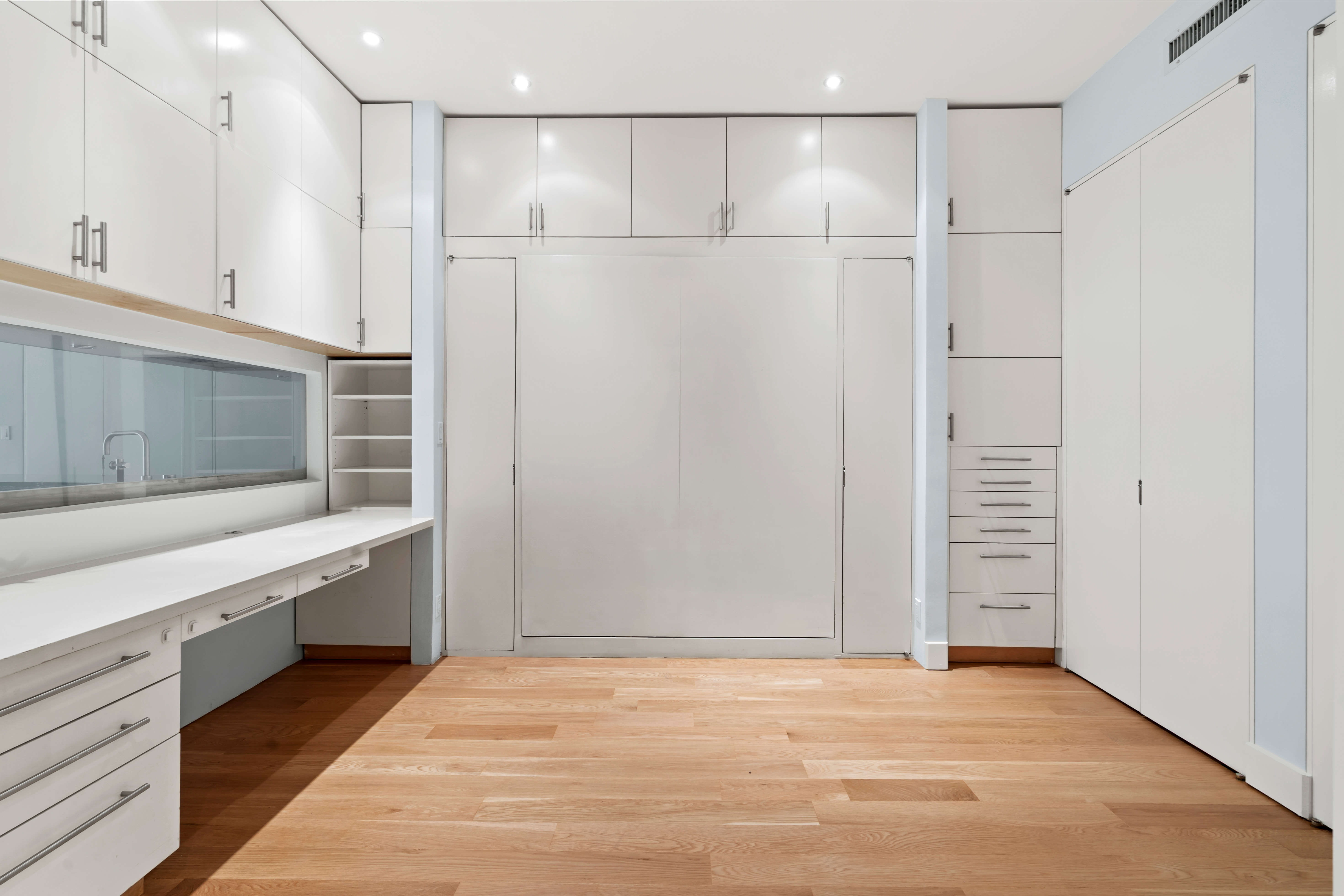32 Laight Street, Unit 5 Manhattan, NY 10013 - Photo 27 of 31 a view of kitchen with stainless steel appliances granite countertop cabinets and chandelier