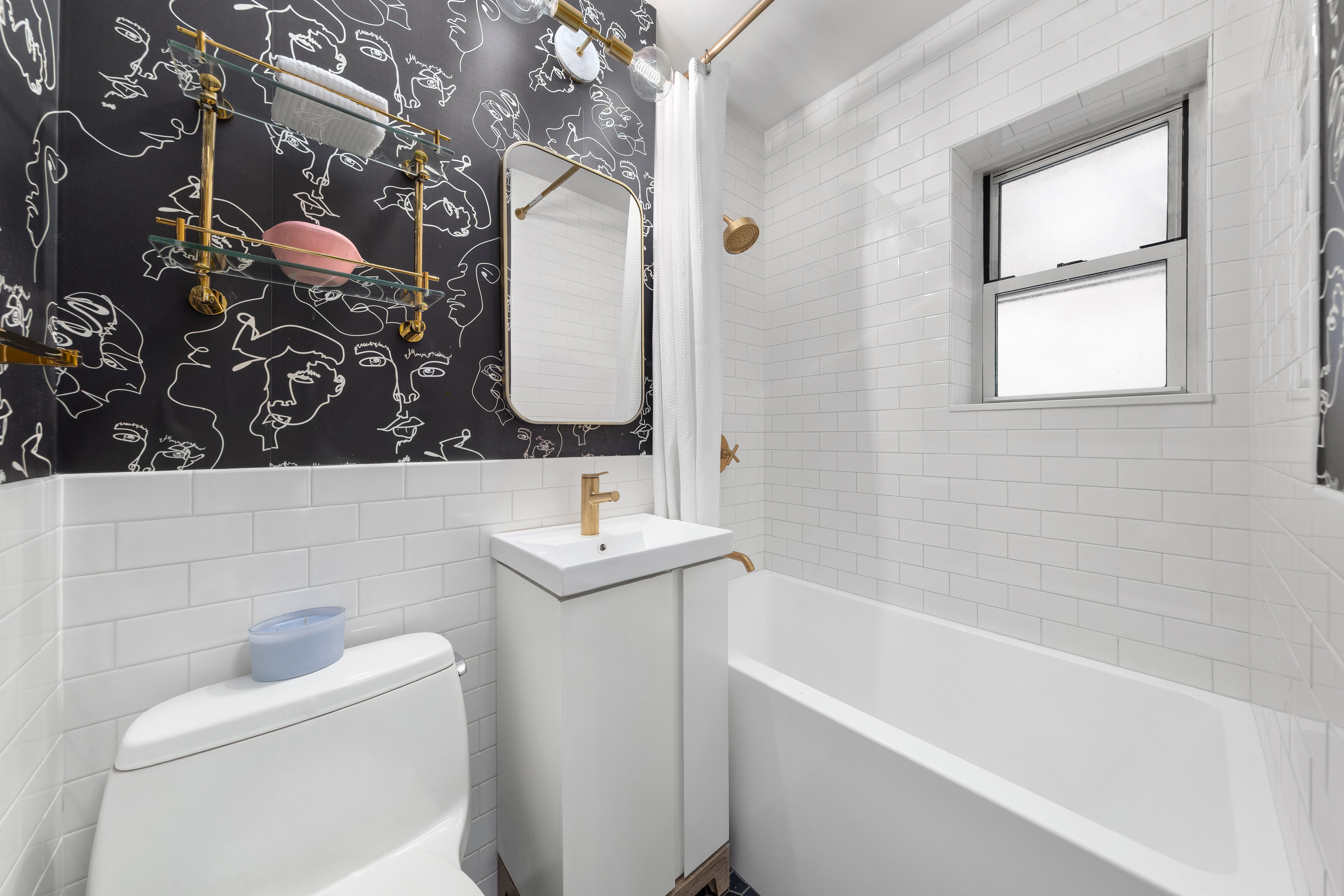 121 East 10th Street, Unit 3D Manhattan, NY 10003 - Photo 5 of 6 a bathroom with a bathtub sink vanity mirror and toilet