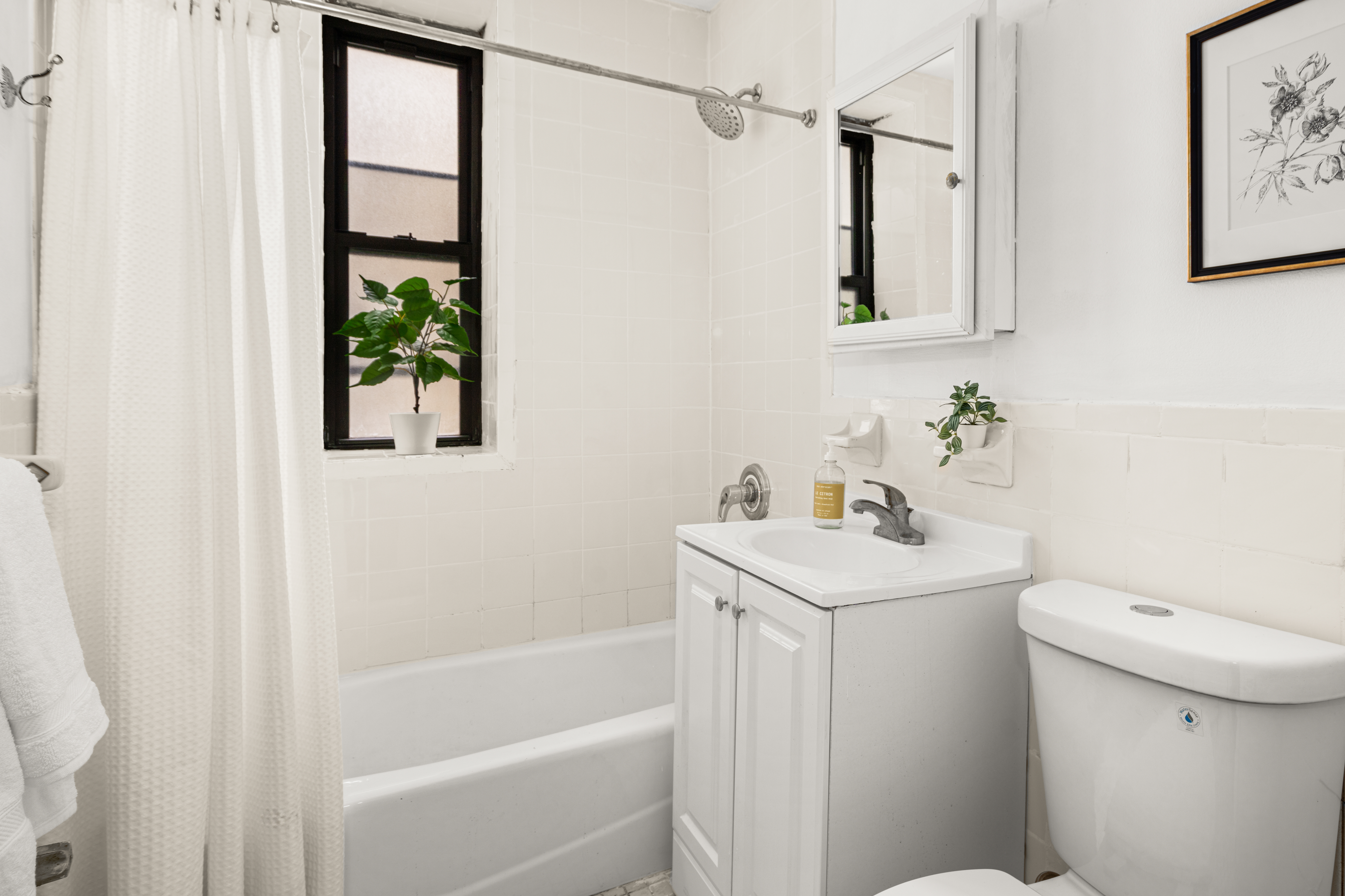 465 Eastern Parkway, Unit C Brooklyn, NY 11216 - Photo 6 of 12 a bathroom with a sink a toilet and shower