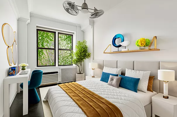 55 West 83rd Street, Unit GARDEN Manhattan, NY 10024 - Photo 5 of 6 a bedroom with a bed and a table