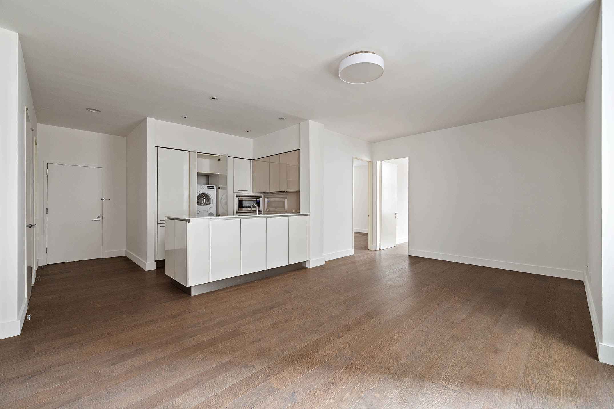 25 Broad Street, Unit 16I Manhattan, NY 10004 - Photo 6 of 23 a view of empty room with wooden floor