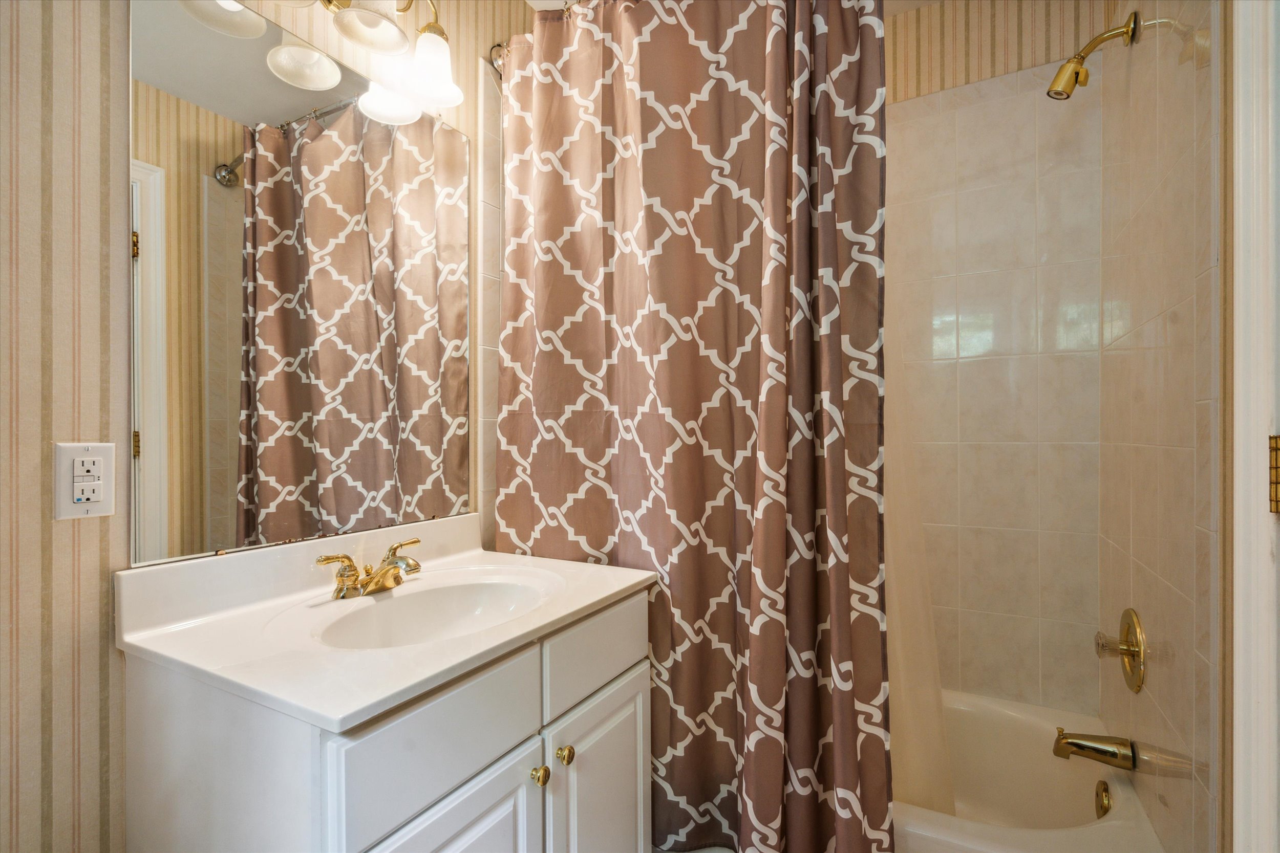 145 Biddulph Road Wayne, PA 19087 - Photo 26 of 39 a bathroom with a sink and a mirror