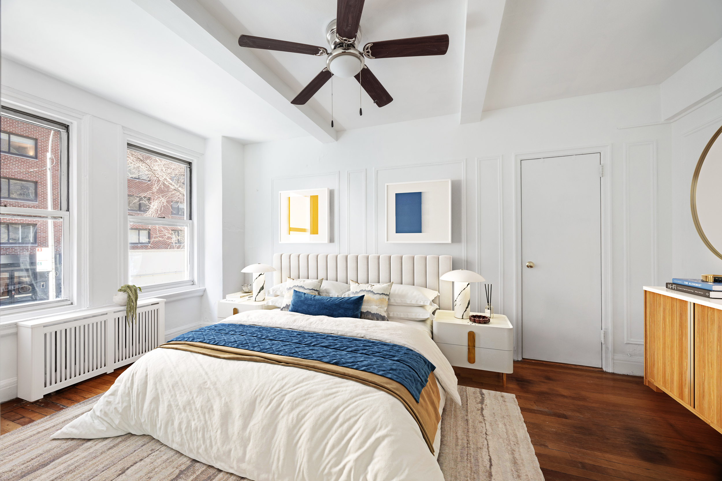 325 West 45th Street, Unit 205 Manhattan, NY 10036 - Photo 5 of 14 a bedroom with a bed and a window