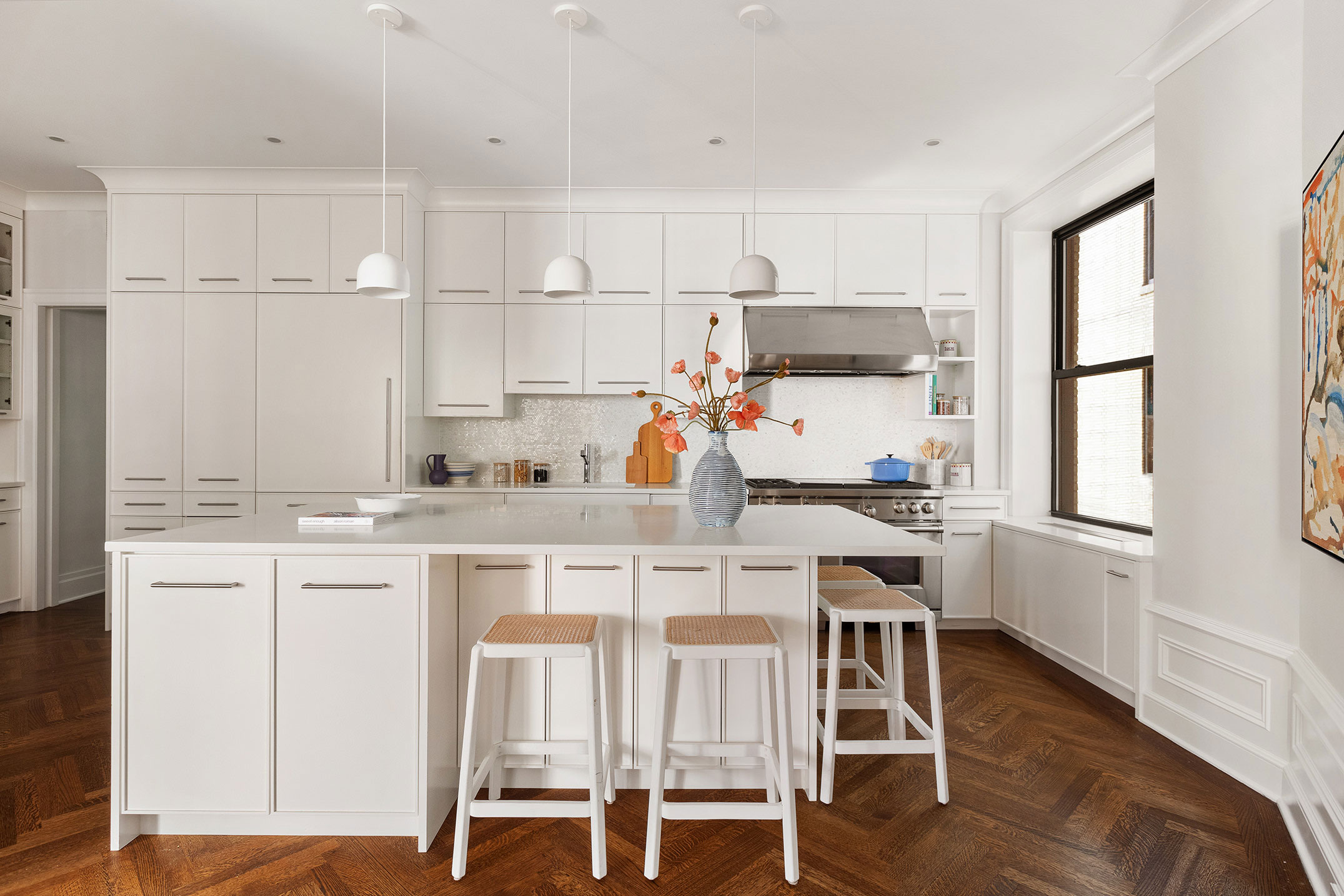 251 West 89th Street, Unit 4D Manhattan, NY 10024 - Photo 4 of 20 a kitchen with a table chairs refrigerator and cabinets