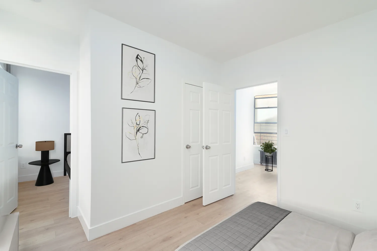 a view of a hallway with paintings on the wall