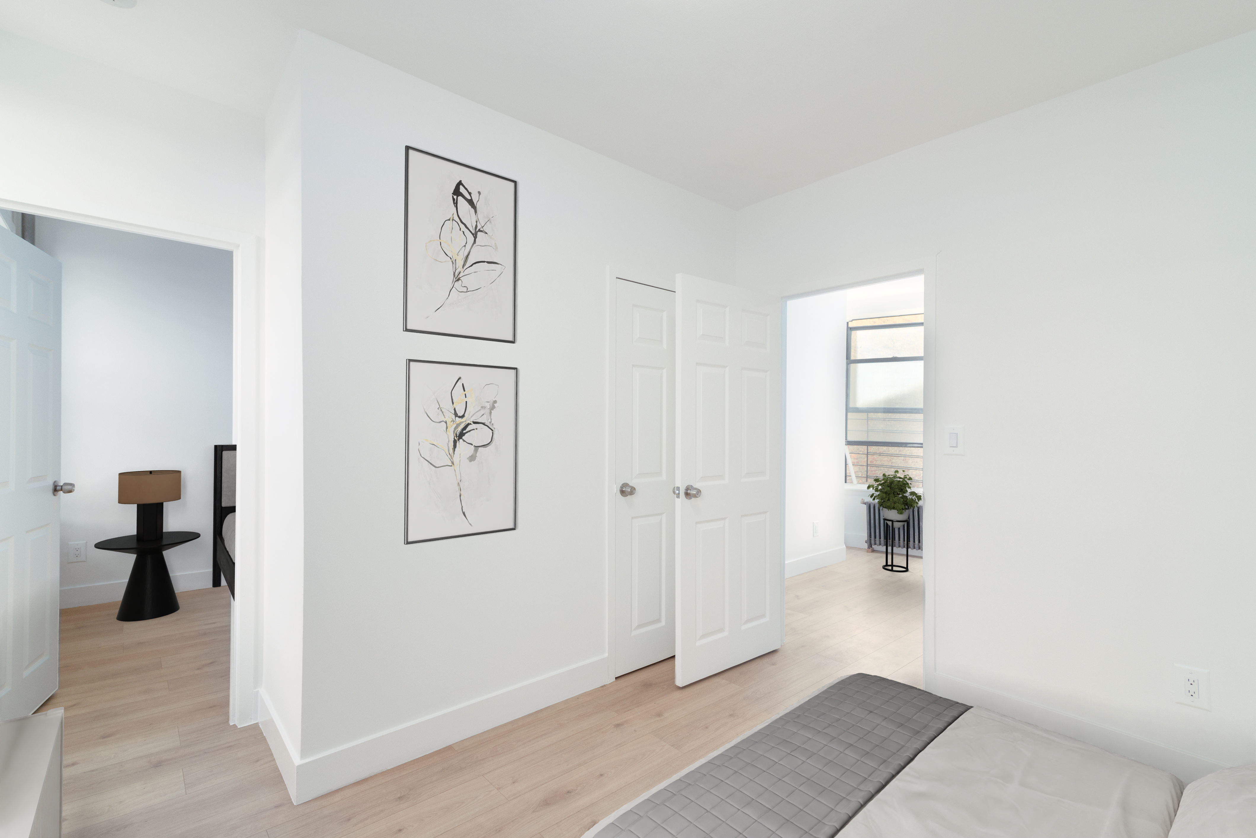 517 West 144th Street, Unit 9 Manhattan, NY 10031 - Photo 5 of 22 a view of a hallway with paintings on the wall