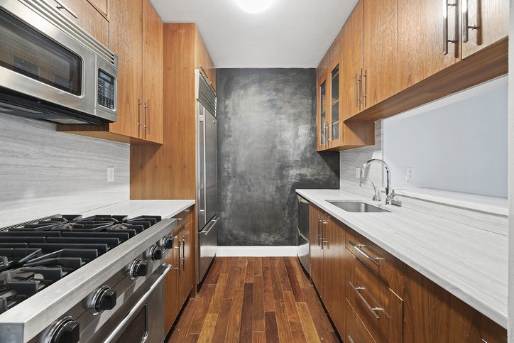 88 Greenwich Street, Unit 1025 Manhattan, NY 10006 - Photo 3 of 14 a kitchen with sink a microwave and cabinets