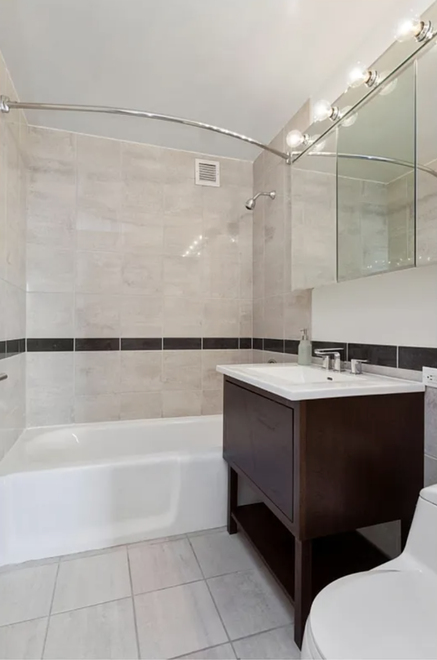 35 West 33rd Street, Unit 32C Manhattan, NY 10001 - Photo 8 of 21 a bathroom with a sink and mirror