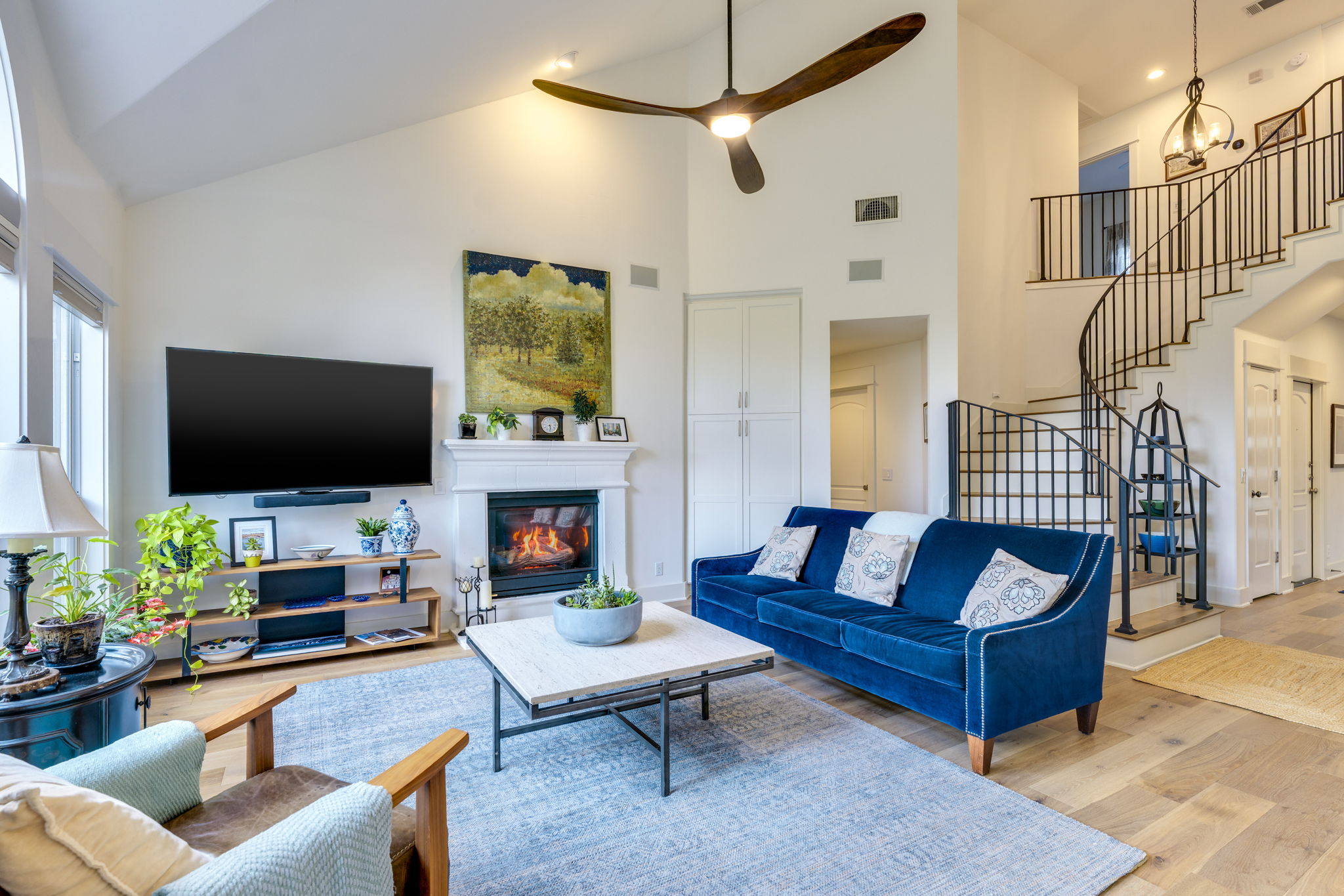 109 West Spring Drive Austin, TX 78746 - Photo 5 of 22 a living room with fireplace furniture and a flat screen tv