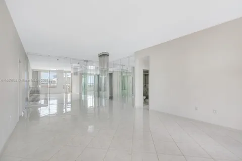 a view of empty room with floor to ceiling window