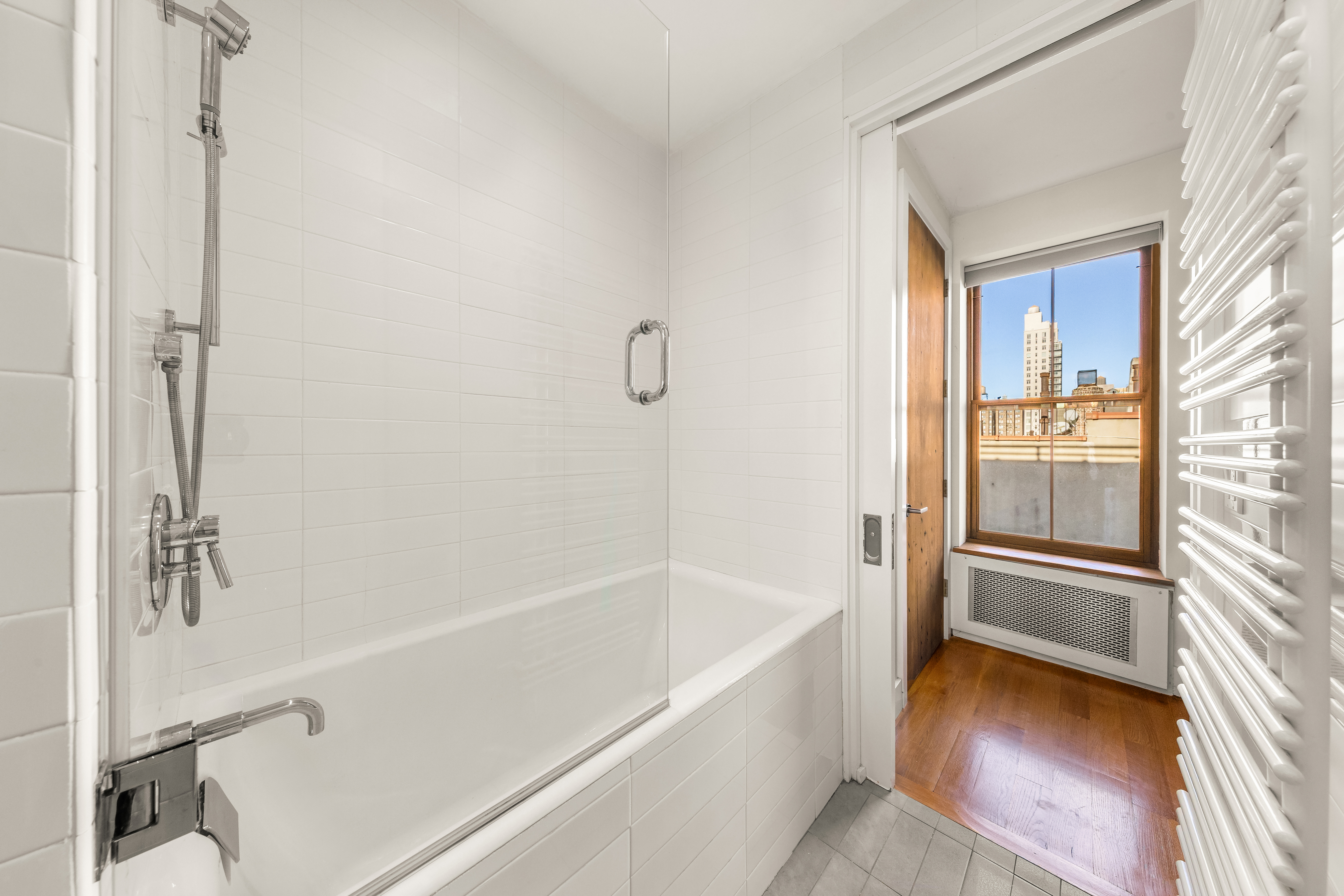 7 West 92nd Street, Unit 76 Manhattan, NY 10025 - Photo 6 of 11 a bathroom with a bathtub and a shower