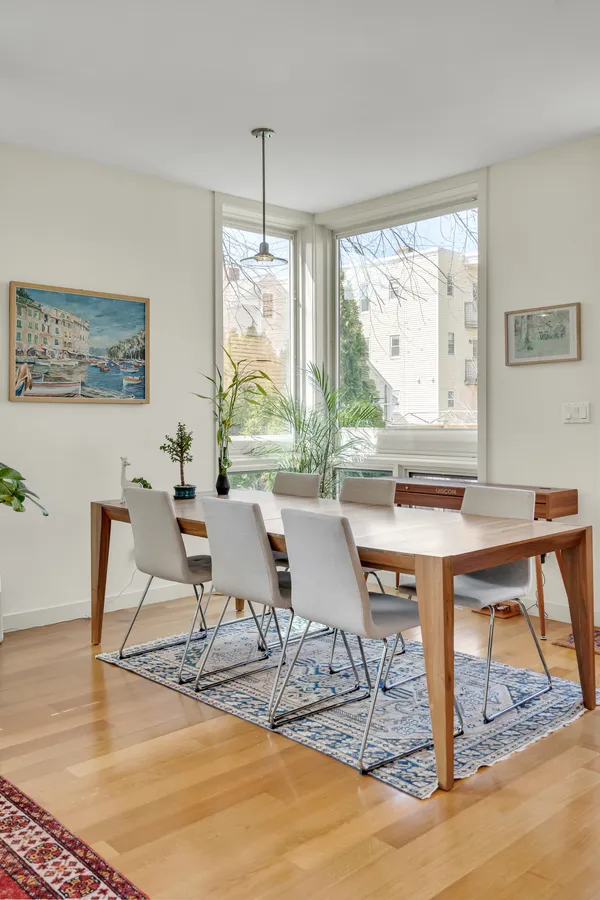 a view of a dining room with furniture window and outside view
