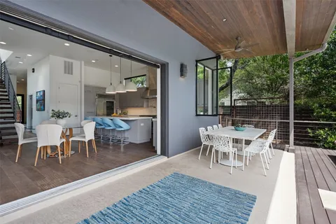 a room with a bed and a flat screen tv