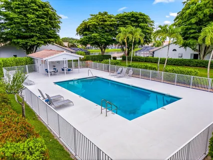 a view of a swimming pool with a patio