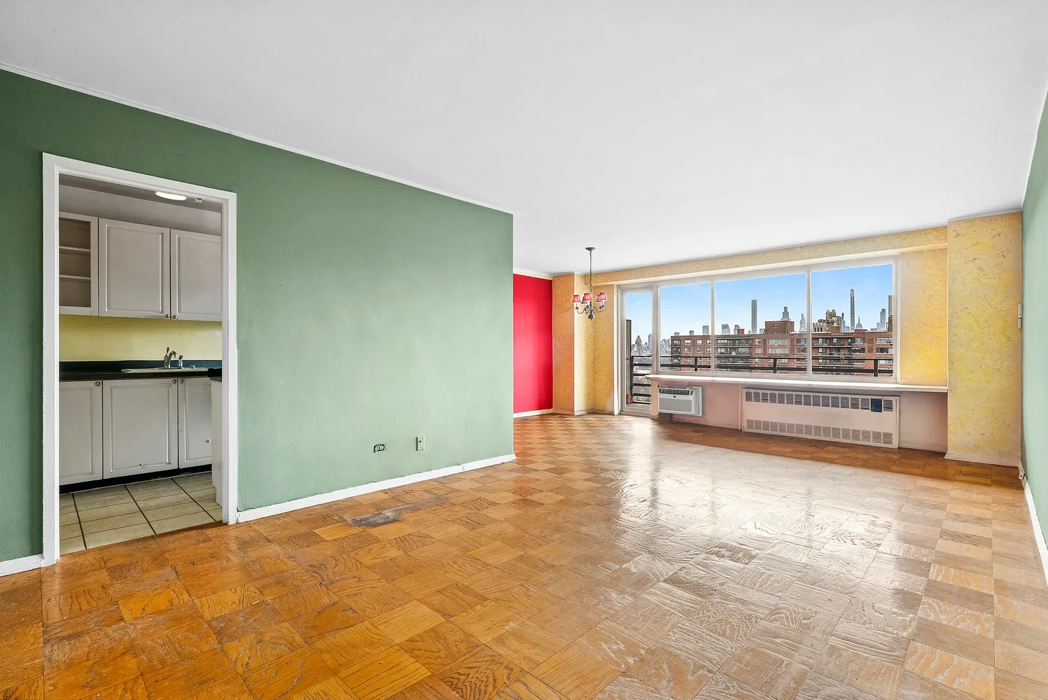 a view of kitchen with refrigerator and window