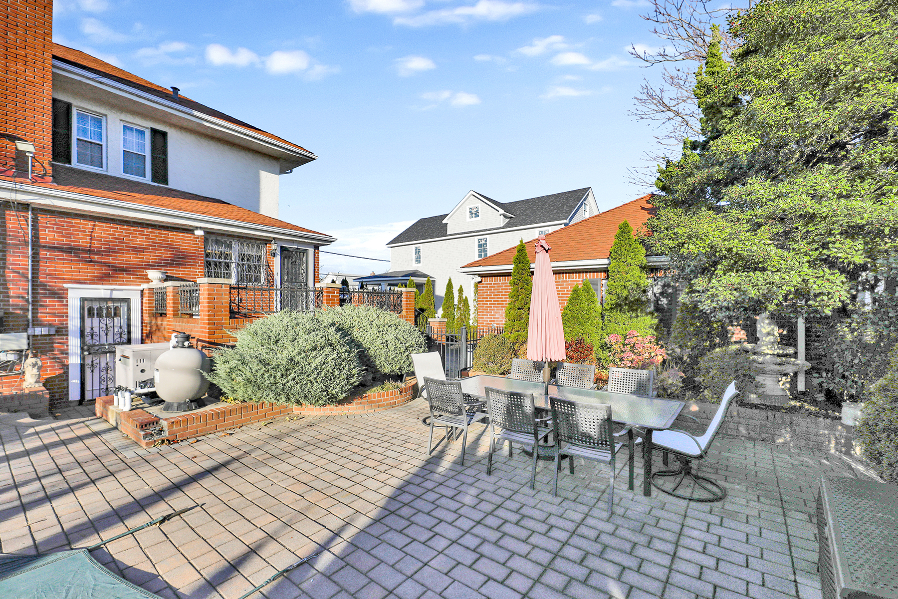 142-15 Newport Avenue Queens, NY 11694 - Photo 40 of 72 a view of a patio with couches table and chairs and potted plants