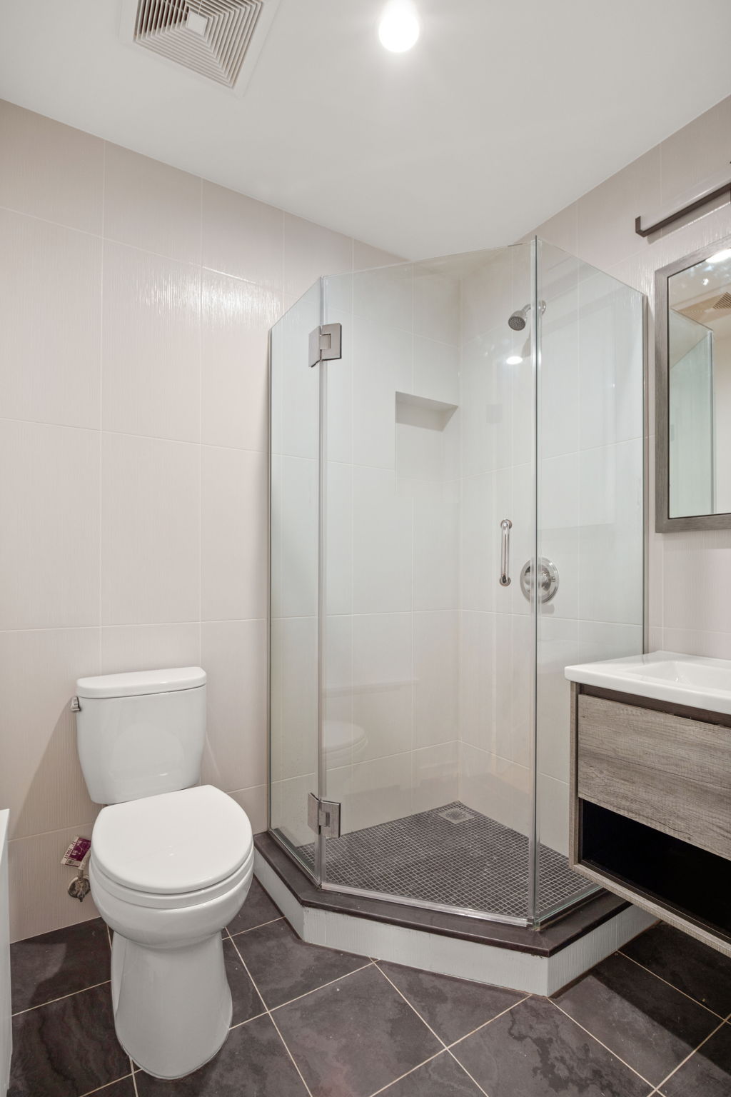 916 Greene Avenue, Unit 1 Brooklyn, NY 11221 - Photo 8 of 9 a bathroom with a toilet and a shower