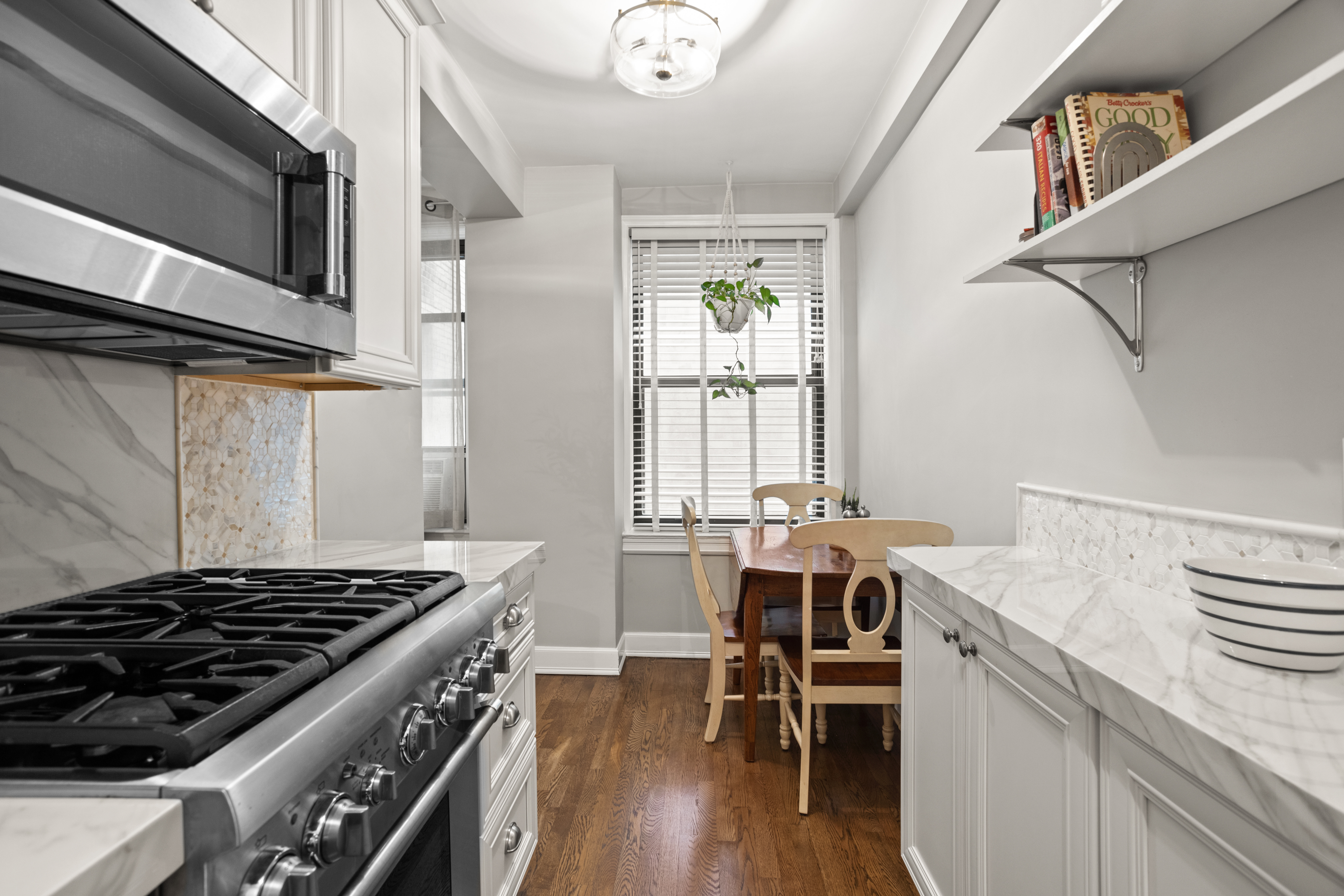 107 West 86th Street, Unit 3H Manhattan, NY 10024 - Photo 4 of 7 a view of a kitchen counter space and wooden floor