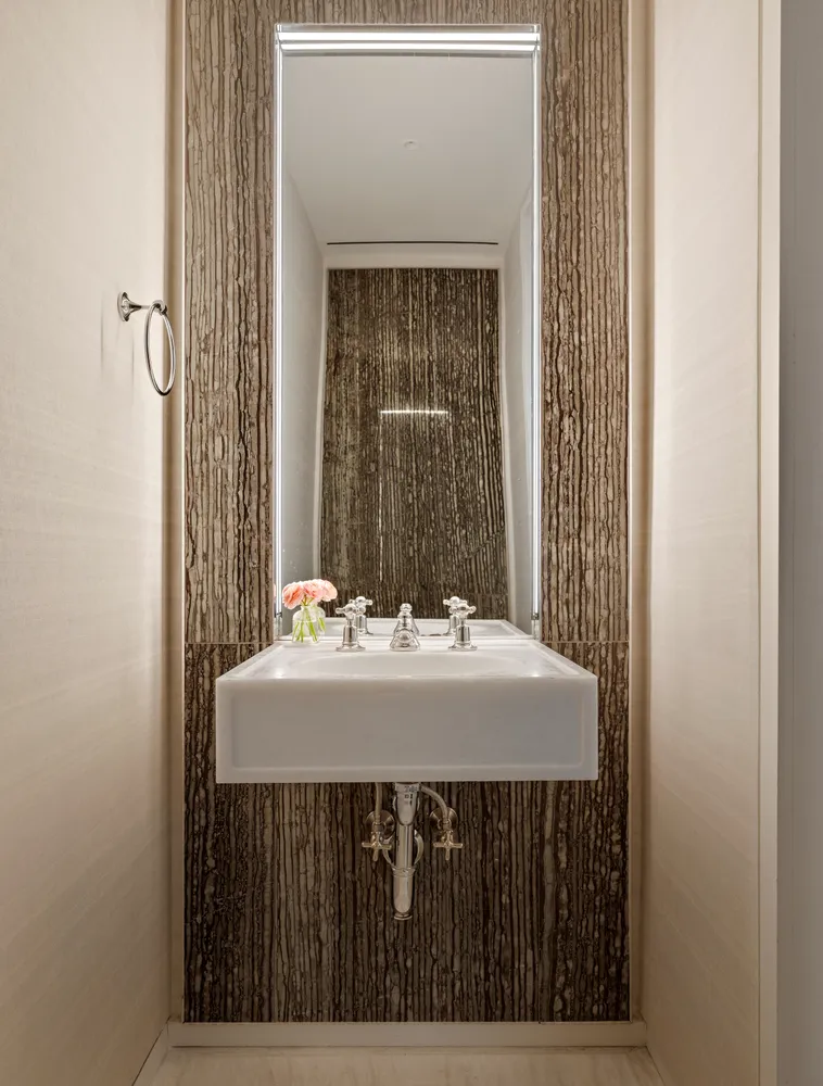 a bedroom with a bed a couch and a window