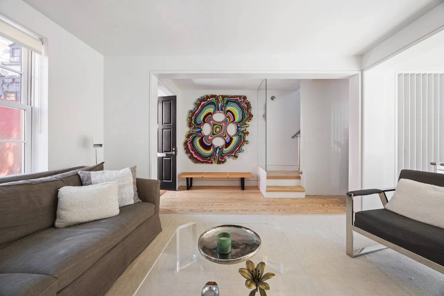 a living room with furniture and a rug