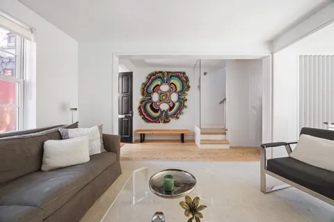 a living room with furniture and a rug