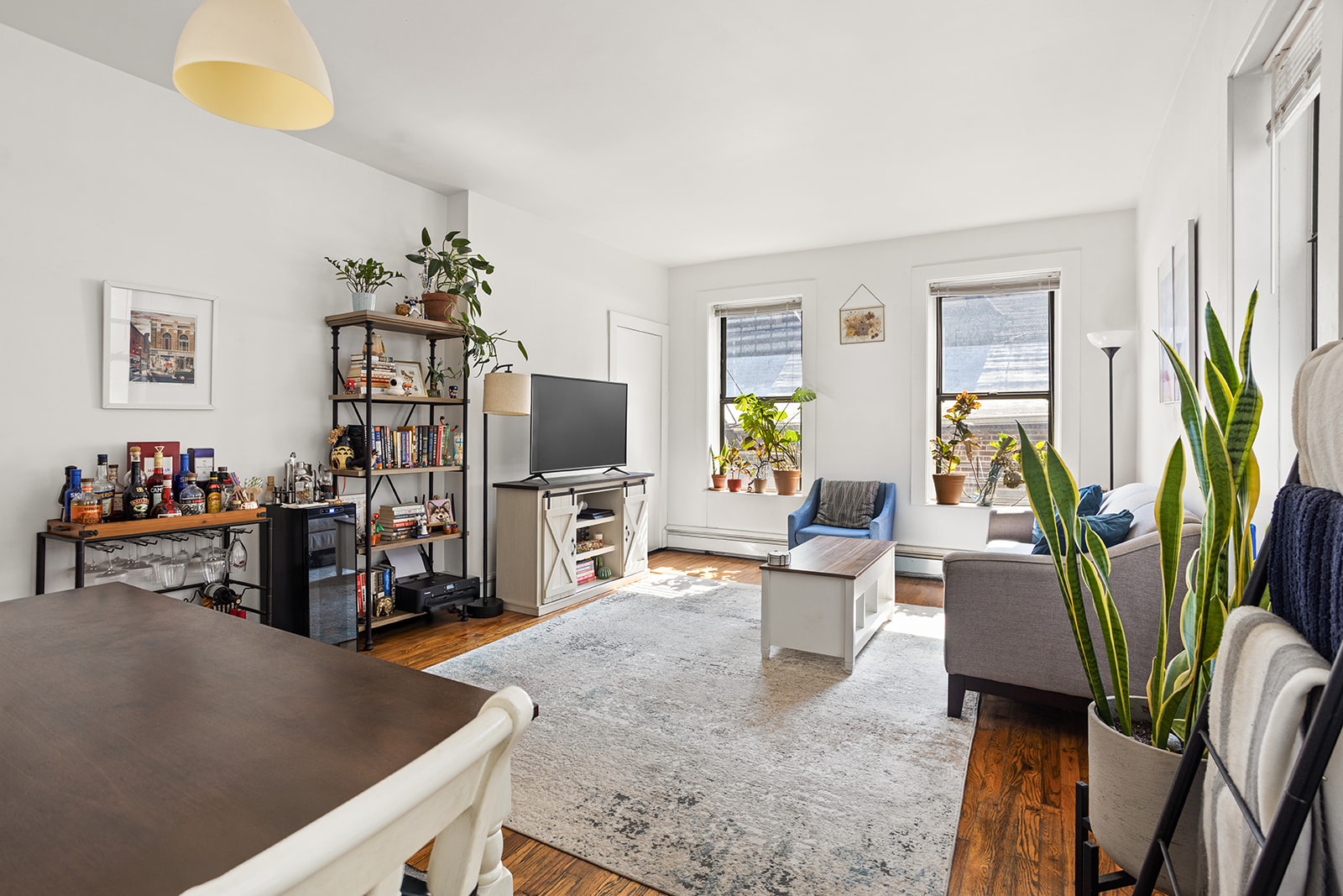 126 Sterling Place, Unit 2C Brooklyn, NY 11217 - Photo 3 of 8 a living room with furniture and a flat screen tv