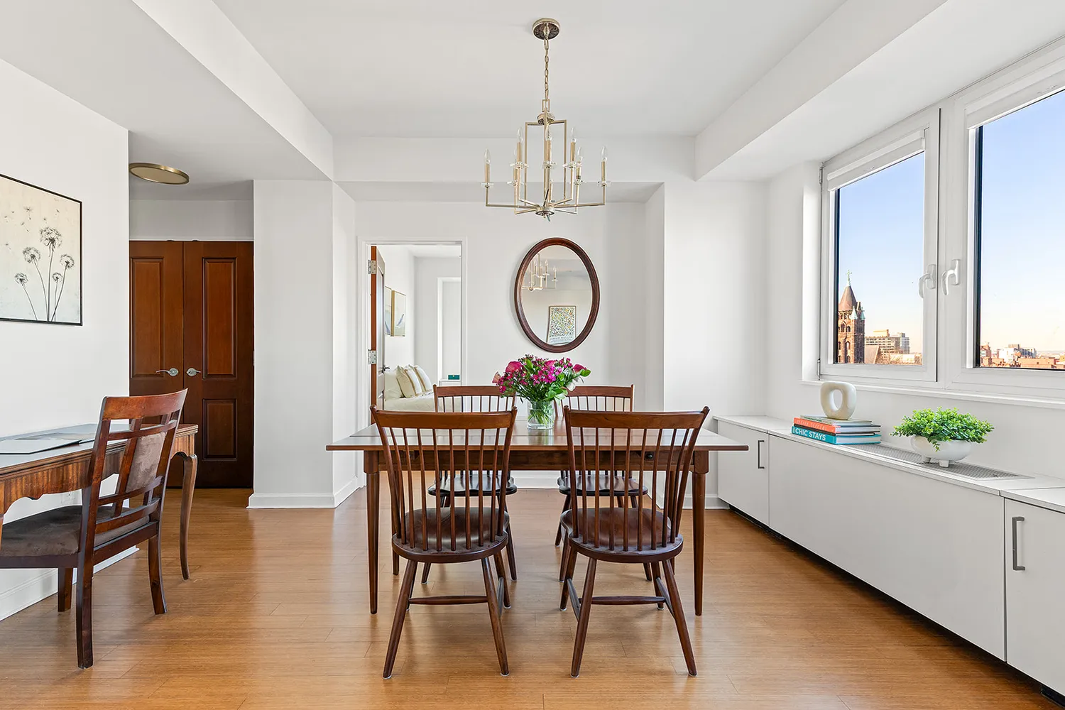 a view of a dining room with furniture window and wooden floor