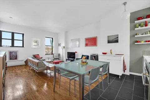 a workspace with furniture and window