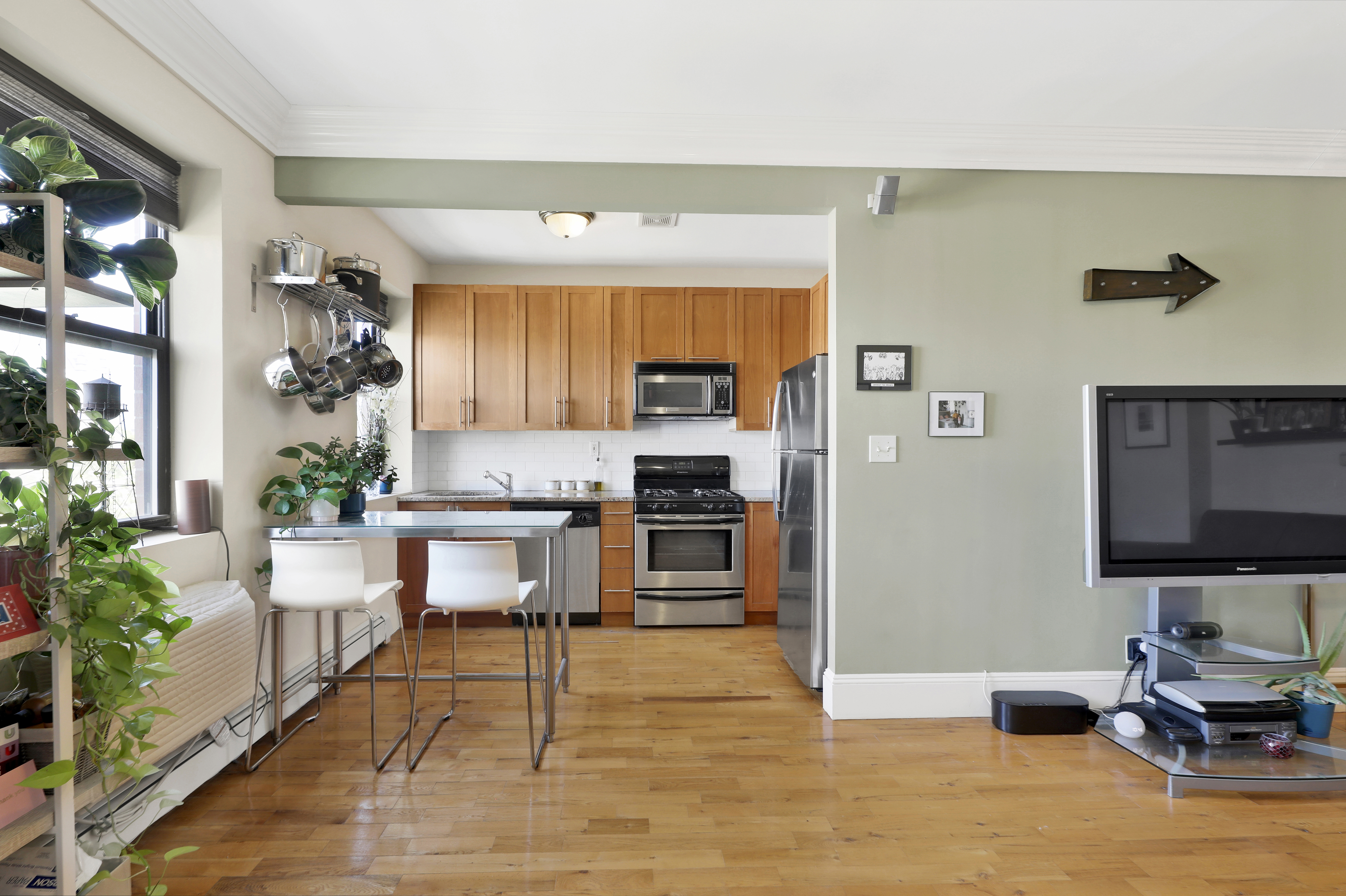 36 Russell Street, Unit 22 Brooklyn, NY 11222 - Photo 9 of 27 a living room with furniture and a flat screen tv