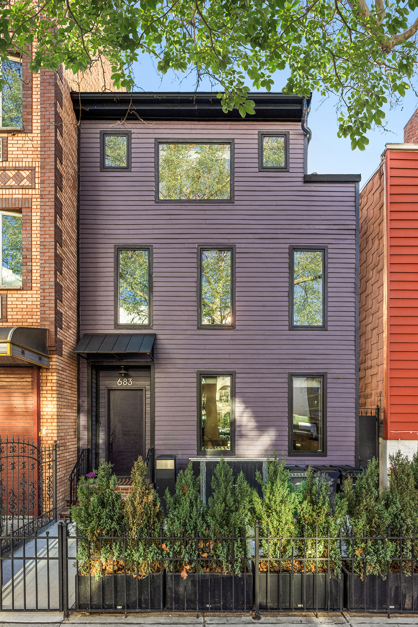 683 Leonard Street Brooklyn, NY 11222 - Photo 24 of 25 a view of a brick building next to a yard