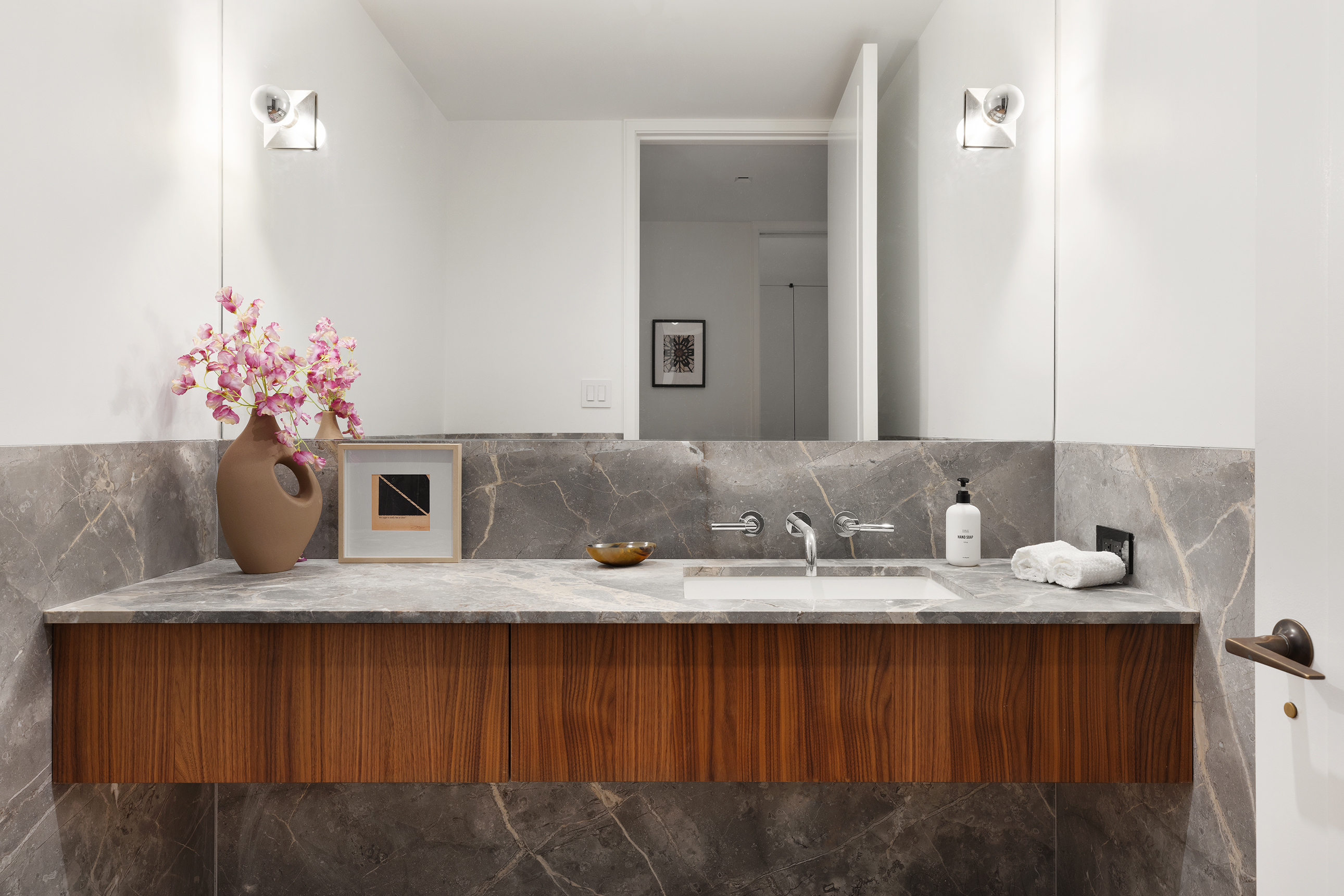 500 West 22nd Street, Unit 2A Manhattan, NY 10011 - Photo 13 of 19 a bathroom with a granite countertop sink and a mirror