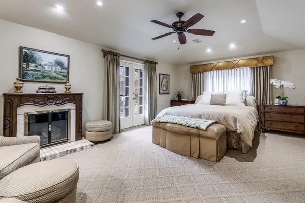 a bathroom with a double vanity sink a mirror a bathtub and shower