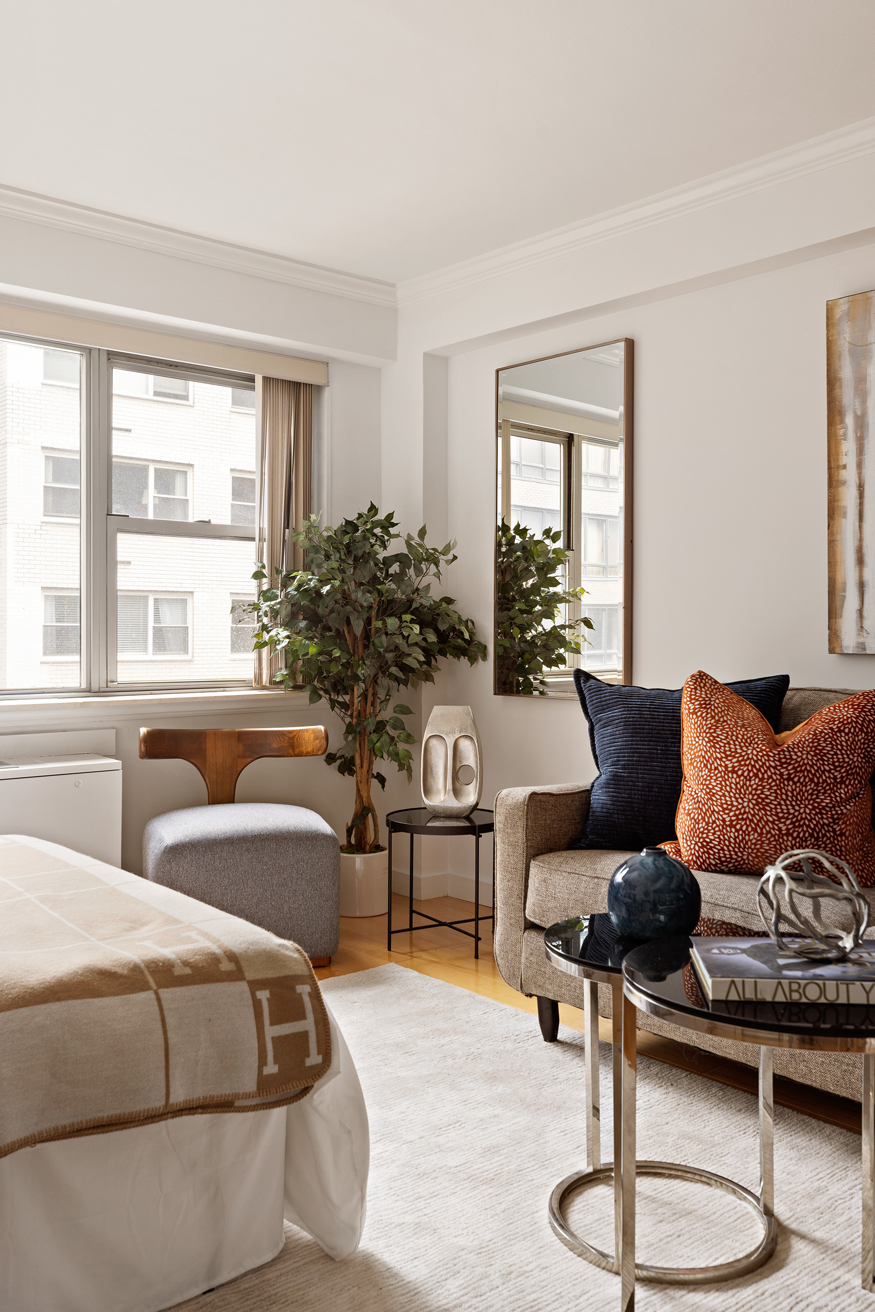 330 East 49th Street, Unit 9C Manhattan, NY 10017 - Photo 2 of 13 a living room with furniture and a large window