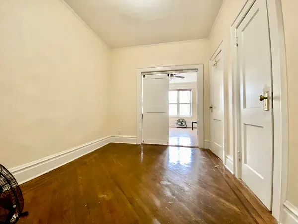 a view of an empty room and glass door