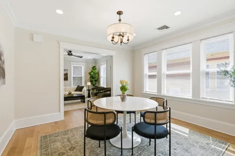 a view of a dining room with furniture and window