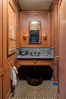 a kitchen with stainless steel appliances granite countertop a stove a sink dishwasher a refrigerator white cabinets and wooden floor next to a window