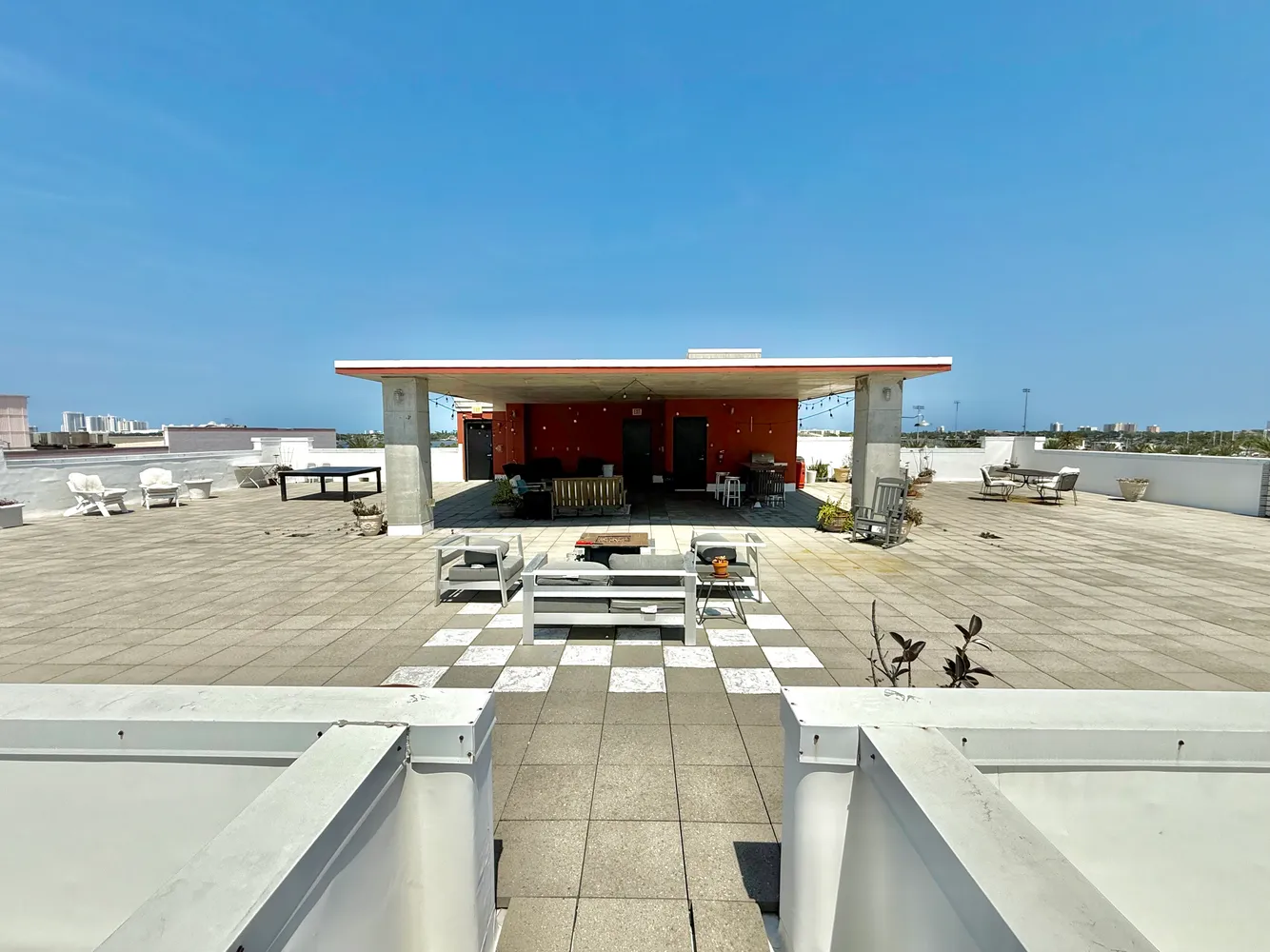 a cars parked on a sidewalk next to a building