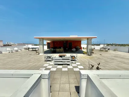 a cars parked on a sidewalk next to a building
