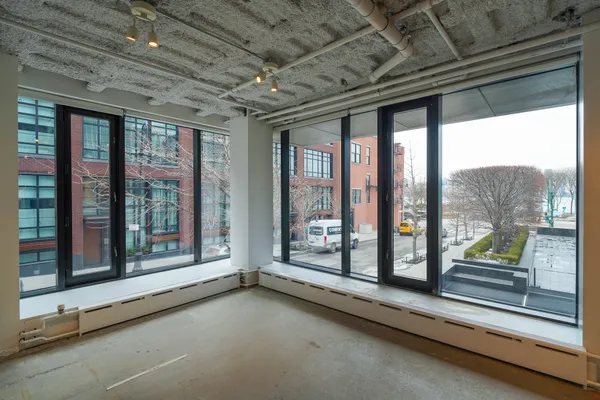 a view of a room with large windows