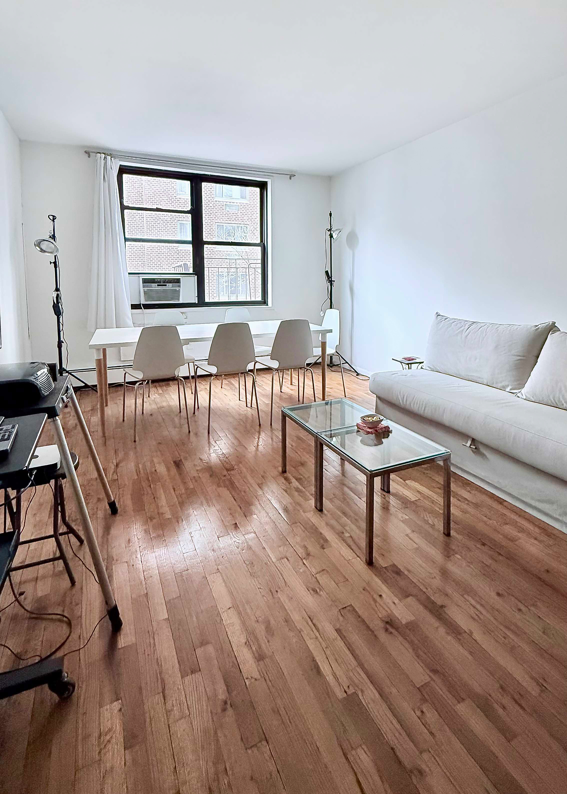229 East 29th Street, Unit 5H Manhattan, NY 10016 - Photo 2 of 15 a living room with furniture and a wooden floor