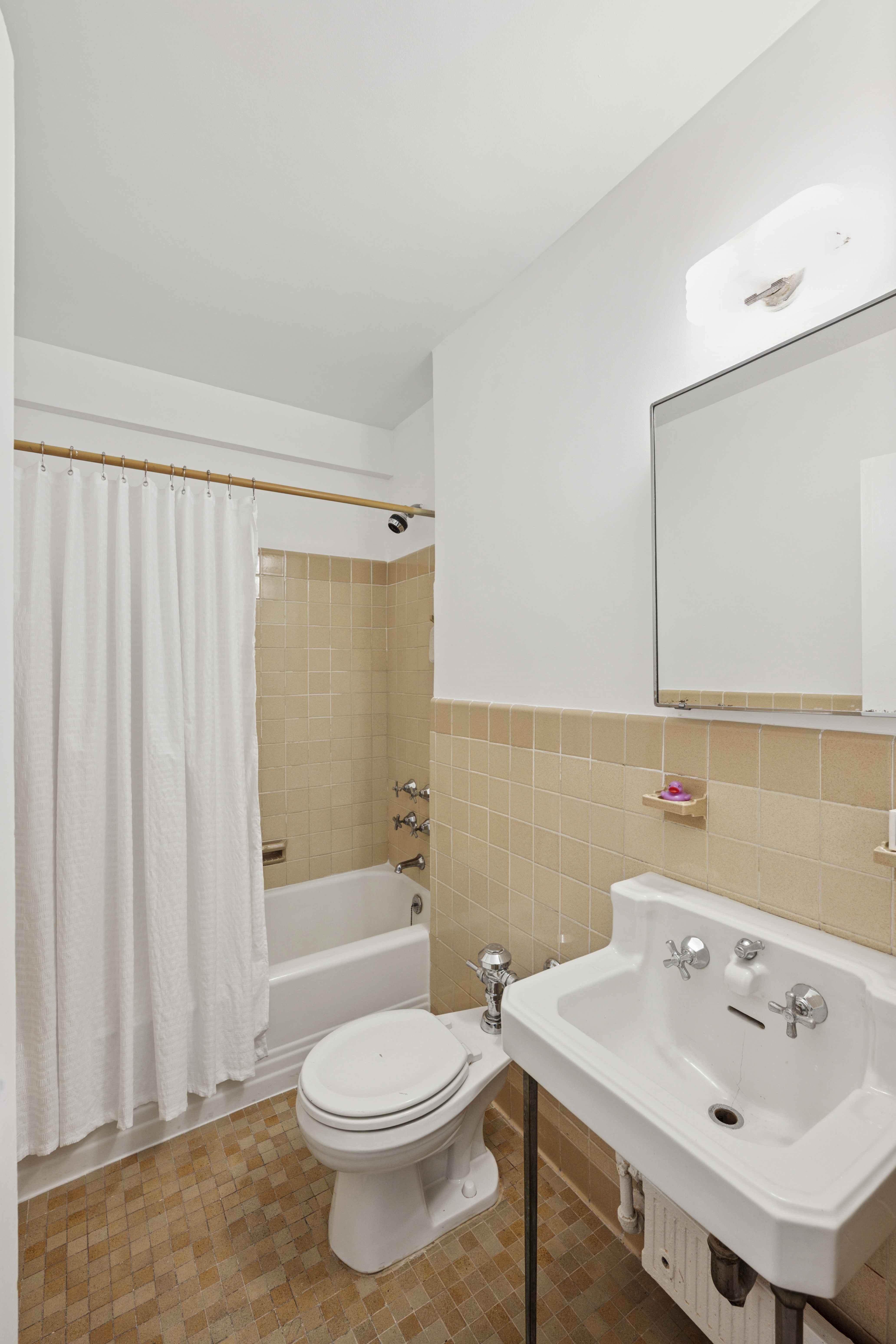 140 Riverside Drive, Unit 10N Manhattan, NY 10024 - Photo 13 of 21 a bathroom with a sink toilet and shower