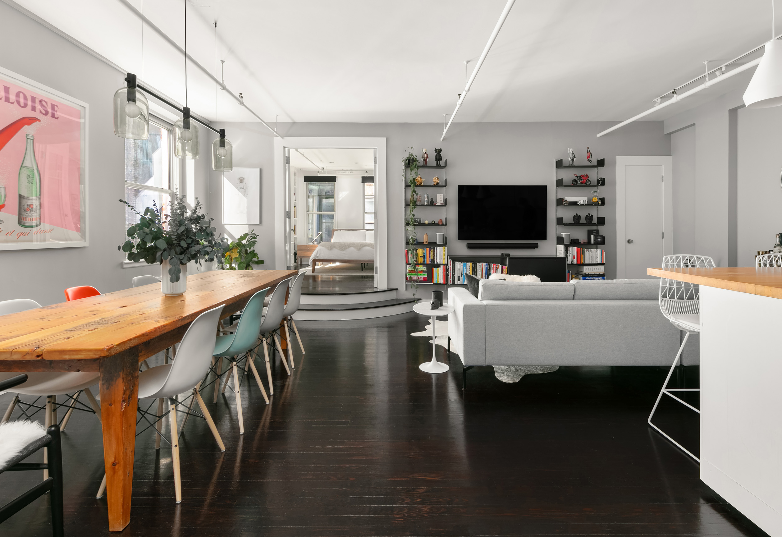 133-131 West 28th Street, Unit 6C Manhattan, NY 10001 - Photo 3 of 10 a living room with dining room and wooden floor