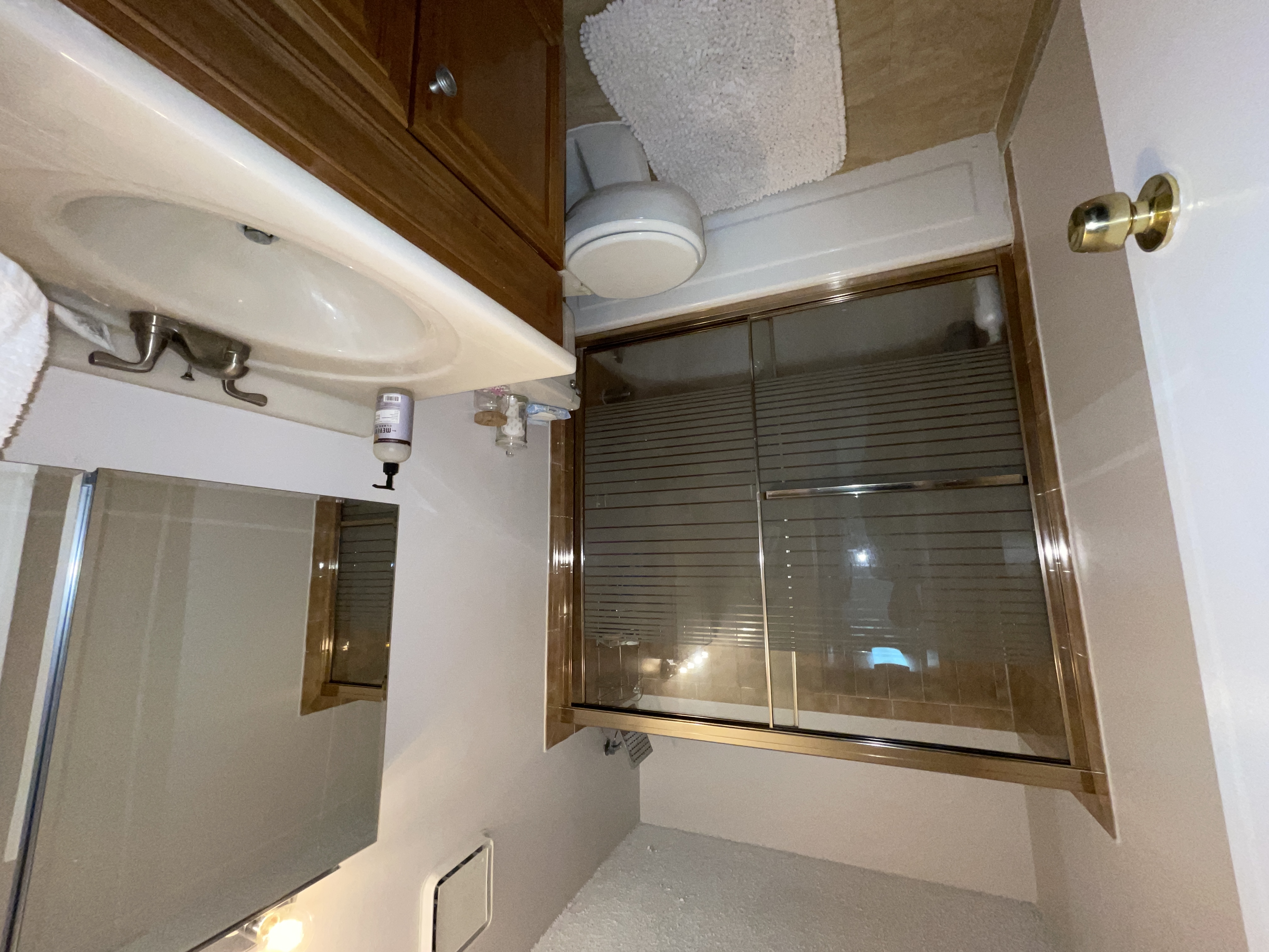 25-40 Shore Boulevard, Unit 8T Queens, NY 11102 - Photo 11 of 23 a bathroom with a sink toilet and shower